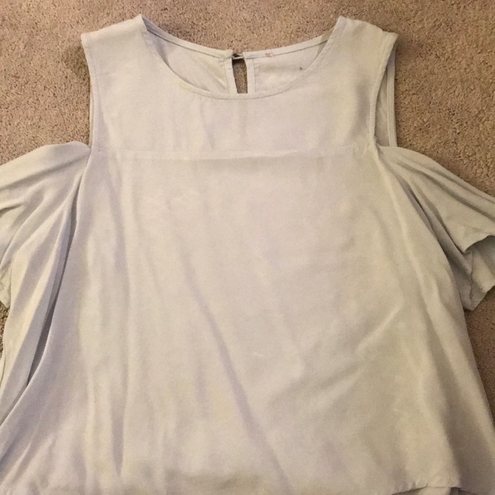 Light blue blouse with shoulder cut-outs